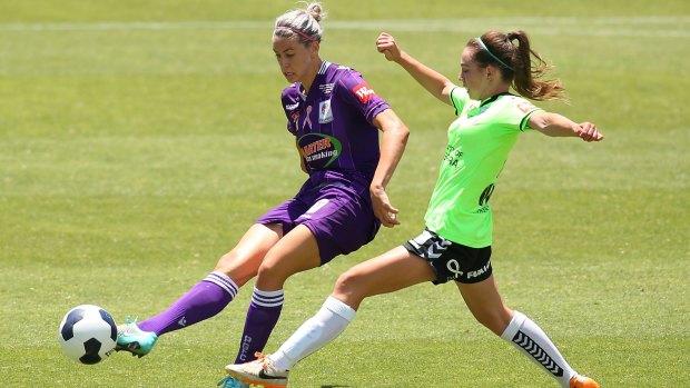 Canberra's Grace Maher challenges Perth Glory's Alanna Kennedy.