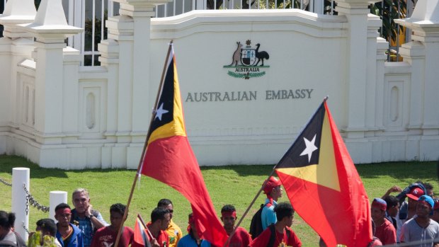 Protesters assembled outside the gates of the Australian embassy in Dili in February, demanding negotiations over the Timor Sea boundary.