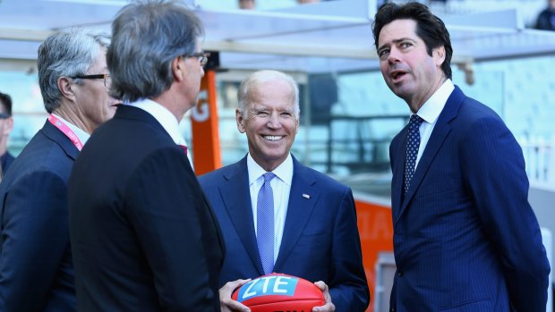 US Vice President Joe Biden speaks to AFL CEO Gillon McLachlan and other league officials before the Blues-Eagles game.