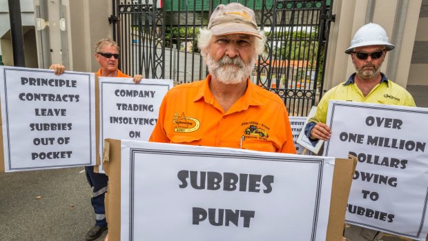 Subcontractor Barry Mitchell protests at the Eagle Farm redevelopment where two men were crushed to death, claiming he hasn't been paid for months.