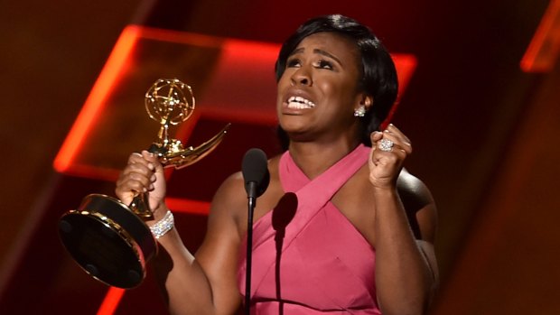 Actress Uzo Aduba accepts an Outstanding Supporting Actress Emmy for her role in Orange is the New Black.