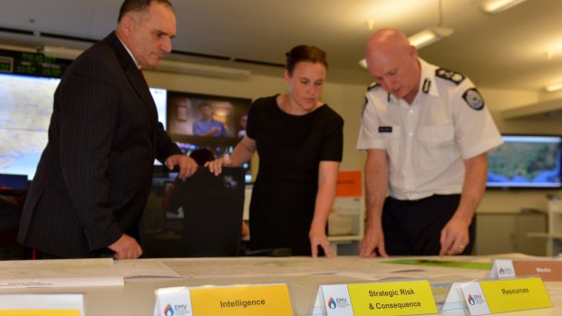 Joe Buffone, with the then emergency services minister, Jane Garrett, and Emergency Management Commissioner Craig Lapsley at the state control centre in October last year.