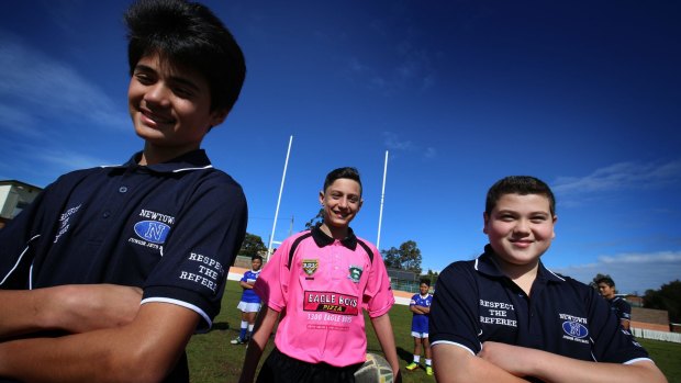 Newtown Junior Jets Rugby League players  Kaylib Savage and Michael Sassine wearing 'Respect our Refs' shirts, with Junior Referee Luke Prokopiou.
