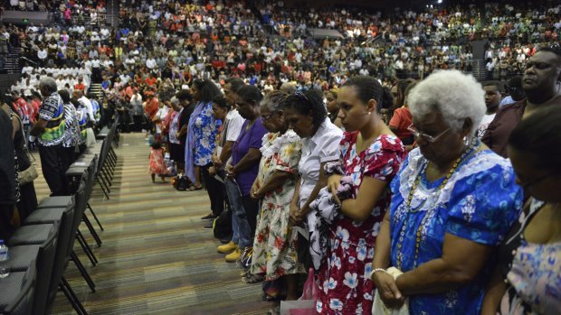 Mourners fill Cairns Convention Centre.