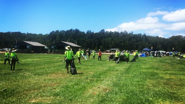 Cleaning crews going through the Falls Festival campgrounds at Byron Bay after campers left.