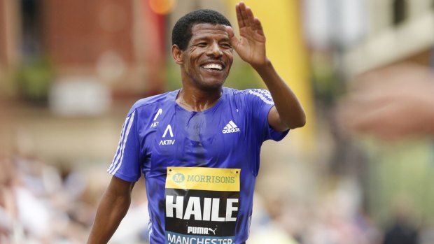 Ethiopia's Haile Gebrselassie crosses the finish line in Manchester.