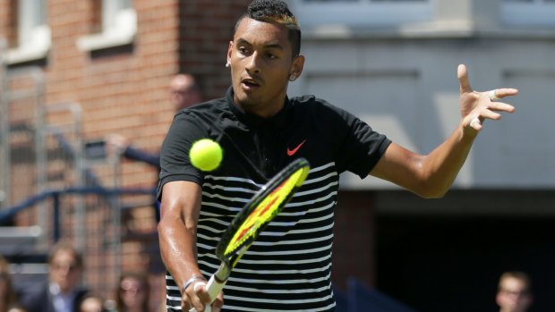 Nick Kyrgios plays a backhand to Switzerland's Stan Wawrinka at Queen's on Tuesday.