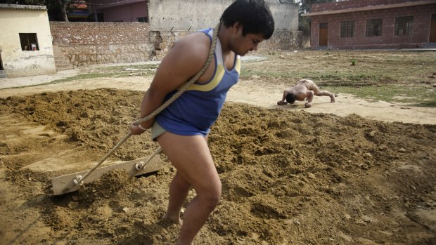 Men work out in Fatehpur Beri in the Delhi region of India.