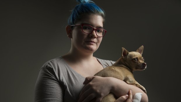 Isabelle Goldstraw with her dog Flea after an attack by two dogs killed her other pet chihuahua in her living room and left her with an injured finger. 