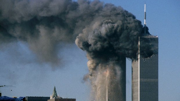 Smoke rises and debris falls after the World Trade Centre in New York was attacked on September 11, 2001.