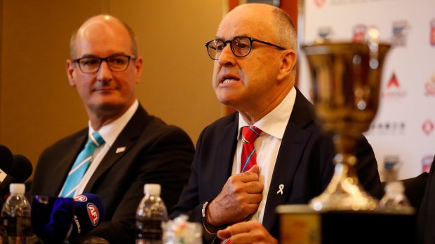 David Koch (left) and Suns chairman Tony Cochrane in Shanghai on Friday: 'We are building trade bridges, we are building diplomatic bridges. This is AFL becoming an exporter.' 