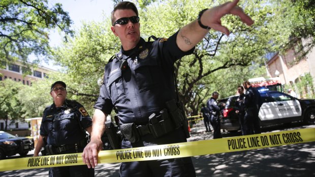 Officers secure the scene after a fatal stabbing attack on the University of Texas campus.