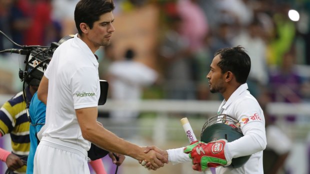 Over and out: Bangladesh captain Mushfiqur Rahim, right, shakes hand with England captain Alastair Cook.