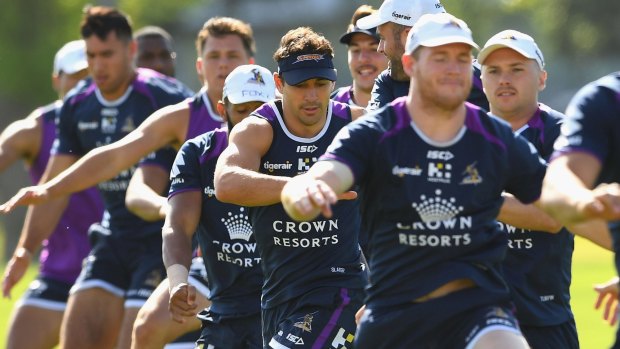 Billy Slater (centre) makes his comeback for Melbourne Storm on Thuesday.