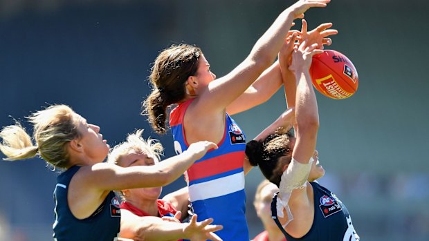 Gabriella Pound of the Blues attempts to mark during the round five AFL Women's match between the Carlton Blues.