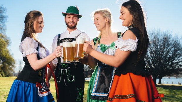 Maddie Welsh, Patrick Gallagher, Zoe Kooyman, and Carly Farmington enjoying a stein at the Patrick White Lawns in Parkes ahead of the new Oktoberfest Parklands.