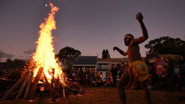Steadman Sailor, 28, from Redfern dances during corroboree at The Block in Redfern, after the protest.