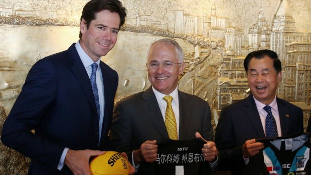 Chinese billionaire Gui Guojie's passion for Port Adelaide remains undiminished – pictured here with AFL's Gil McLachlan and PM Turnbull 