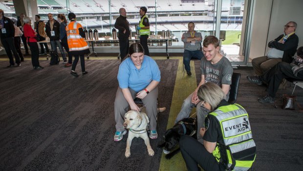 Volunteer victims receive medical assistance for heat stroke during Fridays's exercise to test the Emergency Relief Centre at the MCG.
