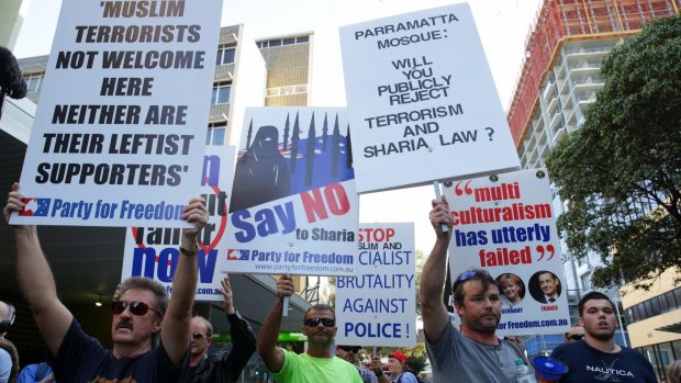 Anti-Islamic protesters approach police in front of Parramatta Mosque. 