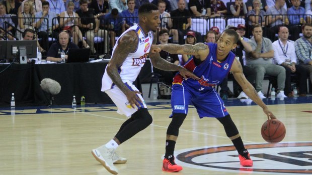 Adelaide's star point guard, import Jerome Randle is guarded closely Bullets import and MVP candidate Torrey Craig on Thursday night.