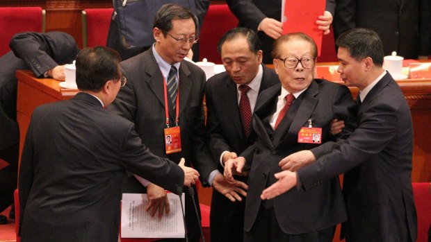 Former president Jiang Zemin leaves the rostrum 