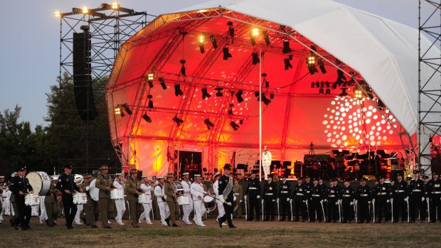 Canberra's Anzac centenary tribute began with a traditional beating retreat ceremony on the Patrick White Lawns in front of the National Library of Australia. 