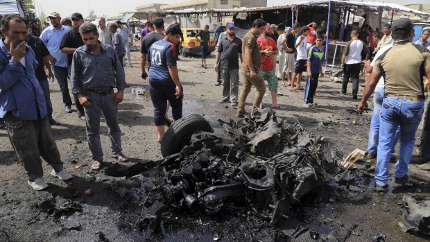 The destruction after a suicide car bomb attack in Sadr City on Tuesday. 