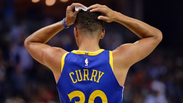 Golden State Warriors guard Stephen Curry has been fined $US50,000 for throwing his mouthguard.