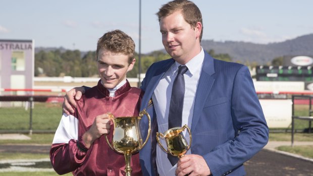 Jockey Sam Clipperton and trainer Kurt Goldman after winning the Canberra Cup on Black Opal Stakes day at Thoroughbred Park.