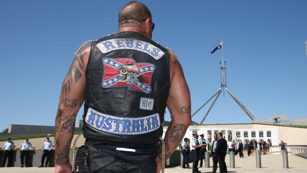 A patched Rebels member who was among riders protesting bikie laws at Parliament House in Canberra in December 2014. Photo: Alex Ellinghausen 