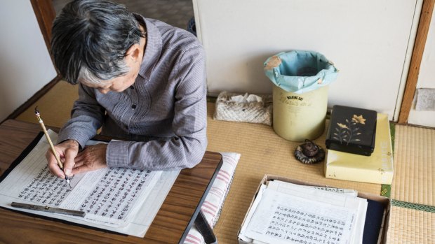 Chieko Ito, 91, writes about her life and lost family members in her apartment, where she has lived for nearly 60 years.