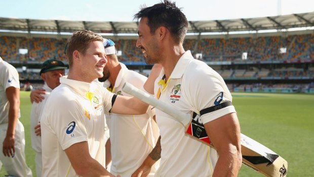 Sweet success: Steve Smith and Mitchell Johnson celebrate Australia's win.