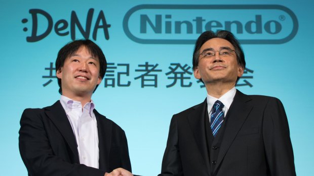 Nintendo president Satoru Iwata (right), and DeNA CEO Isao Moriyasu at the joint press event in Tokyo.