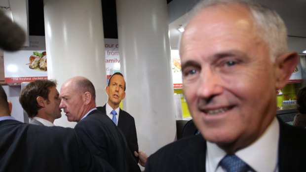 Prime Minister Malcolm Turnbull is stalked by a Tony Abbott cut-out wielded by a member of the satirical Chaser program.