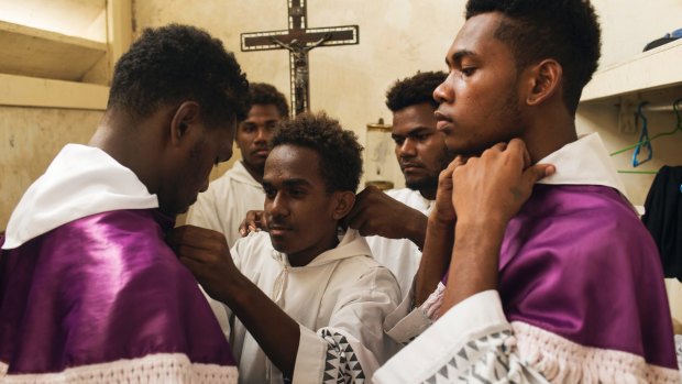 Altar boys at Holy Cross Cathedral in Honiara prepare for a service. 