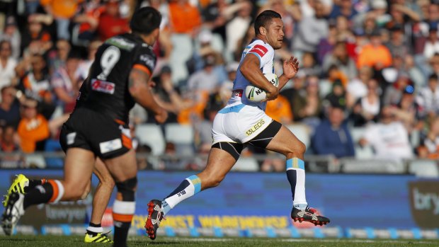 On the break: Hayne shows the Tigers a swift pair of heels.