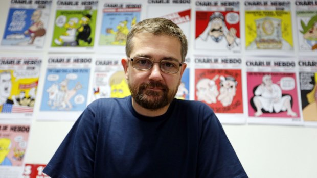 No stranger to controversy ... Charlie Hebdo's publisher, Stephane Charbonnier, in 2012. A 24-year-old man faced trial for allegedly threatening to behead Charbonnier in June, 2013.