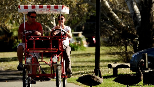 A couple in a Mr Spokes bike on the lake: Mr Spokes says it has been unfairly dealt with in negotiations over its lease.