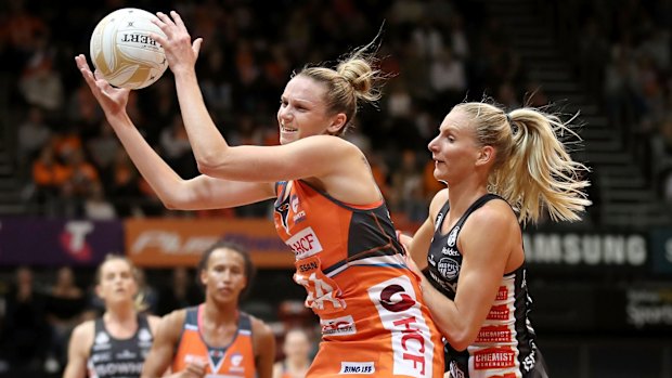 Collingwood's April Brandley puts pressure on the Giants' Jo Harten.