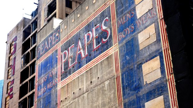 The Peapes ghost sign appeared on George Street, Sydney, after the demolition of buildings on the old Menzies Hotel site. 