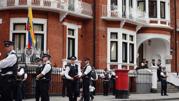 Police stand guard outside the embassy where the founder of WikiLeaks is staying in August 2016.