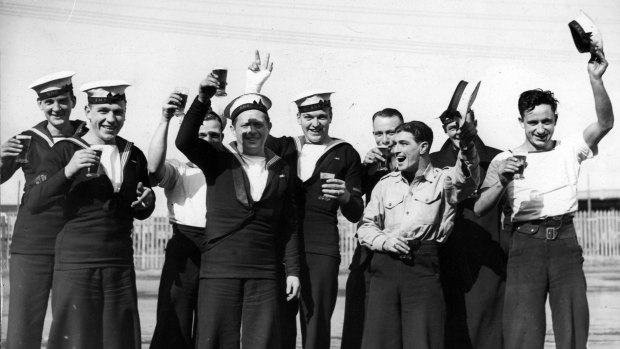 Men who were part of the Normandy landing celebrate in 1945.