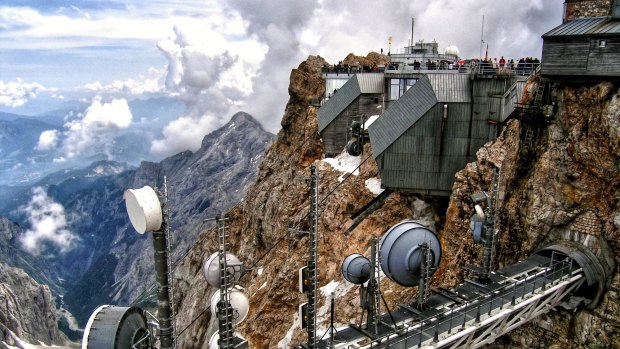 The Zugspitze, at 2962 m above sea level, is the highest peak in Germany. It lies south of the town of Garmisch-Partenkirchen, and the Austria-Germany border runs over its western summit. 