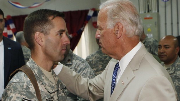 Beau Biden and his father, US Vice-President Joe Biden, meet at Camp Victory on the outskirts of Baghdad in July 2009. 
