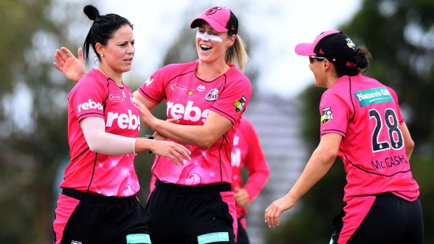 Sydney Sixers celebrate a Women's Big Bash wicket.