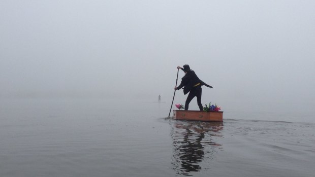 'The Lost Undertaker' turned heads when he rowed his stand-up-paddleboard coffin on Lake Burley Griffin. 