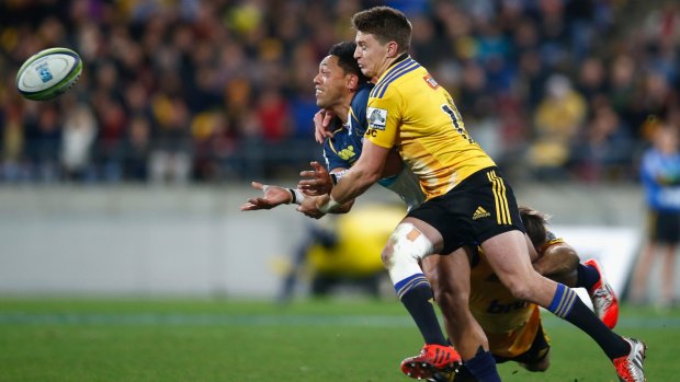 Beauden Barrett of the Hurricanes tackles Christian Lealiifano of the Brumbies in Saturday's semi-final.