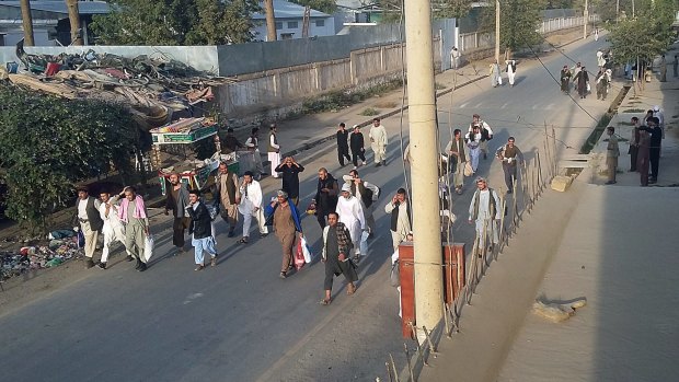 Taliban prisoners walk free after their comrades released them jail in Kunduz.