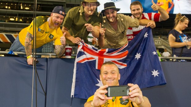 Snap happy: Matt Giteau poses for a fan selfie in the US before the World Cup.